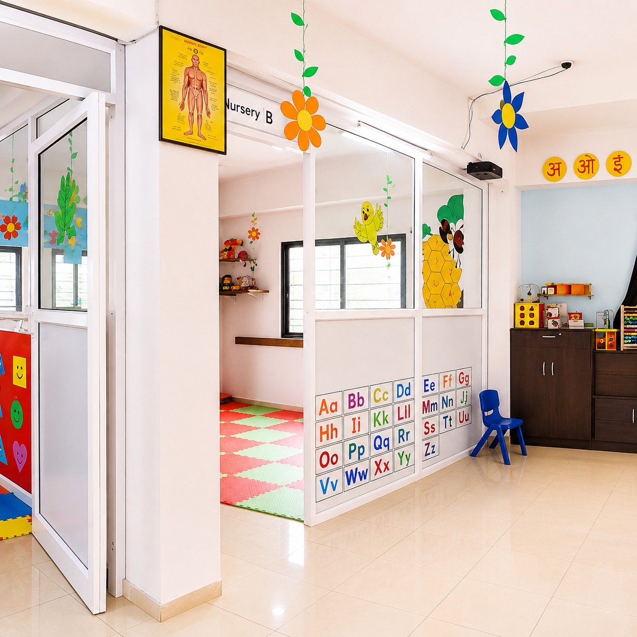 Nursery classroom entrance at the Dwarka branch decorated with alphabet and nature stickers