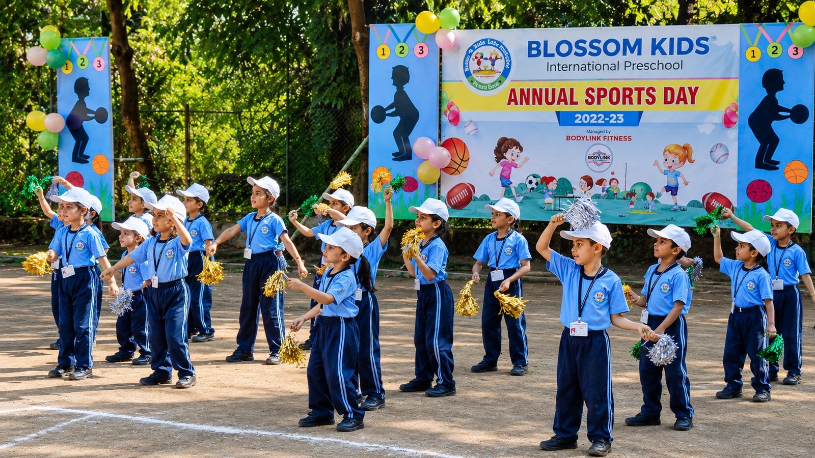 Blossom Kids International Preschool students cheering with pom-poms at their annual sports day